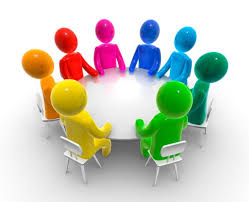 picture or people around a table having a meeting